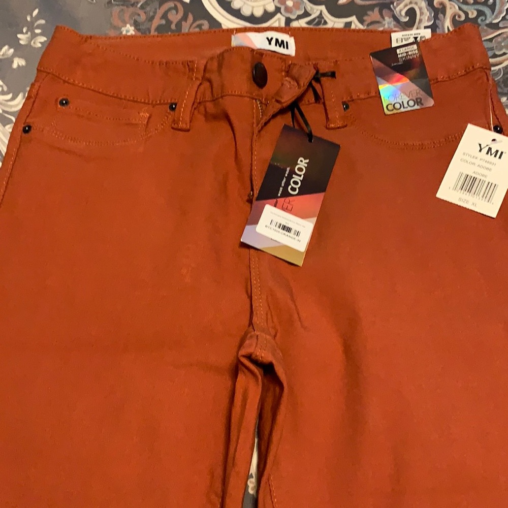YMI mid rise skinny. New with tags. Fits 12-14